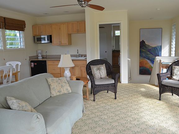 View of Living space taken from sliding glass door to the de