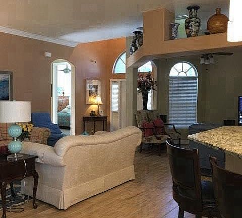 Living room w/ view of third bedroom