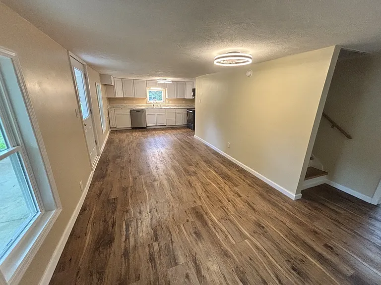 Living room with view of stairs