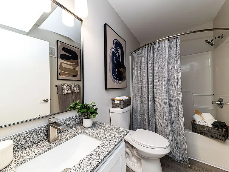 Bathroom with granite counters and high rise faucet