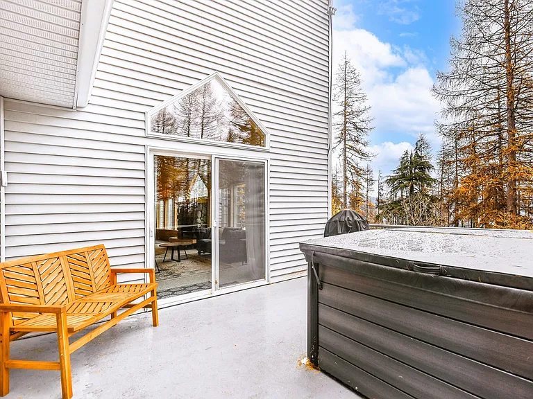 Grill and hot tub on private patio with mountain views