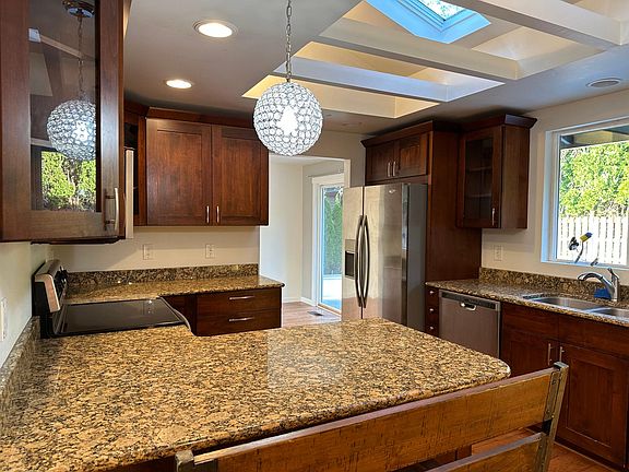 Kitchen with vaulted ceiling.