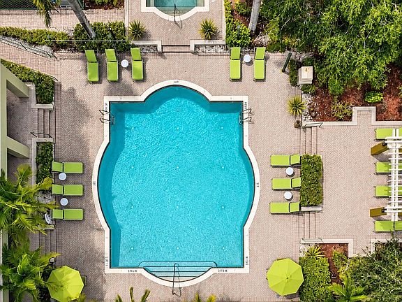Relax in style at Club Mira Lago, where the stunning resort-style pool invites you to unwind. Surrounded by lush greenery and chic lounge seating, this oasis is perfect for sunny days and social gatherings. Reserve your spot in paradise today!
