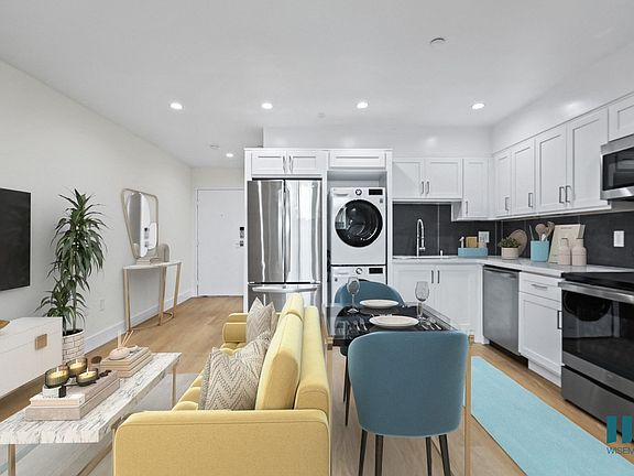 Open-Concept Kitchen with Energy-Efficient Appliances including In-Suite Washer & Dryer