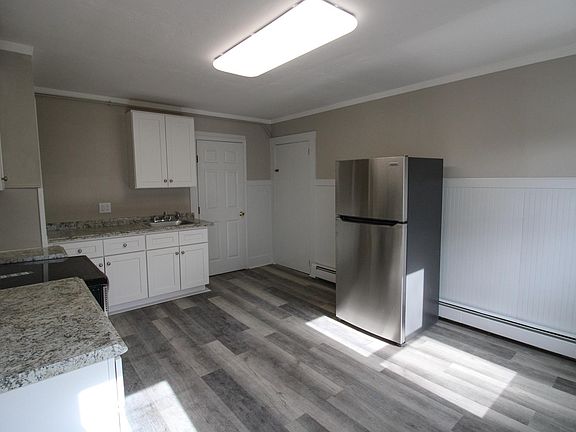 Kitchen with new stainless-steel appliances, new countertops, new floor, and new cabinets!