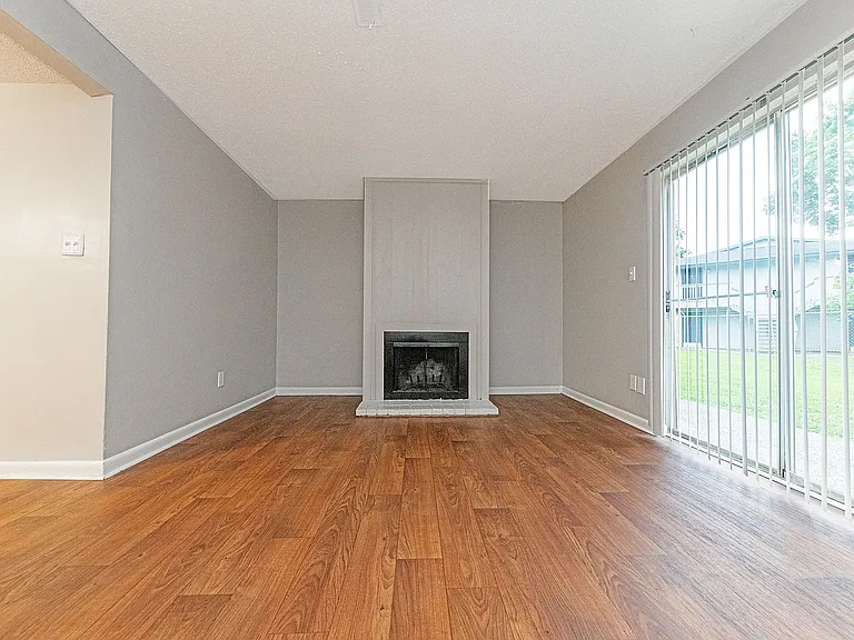 Spacious living room with hardwood-style flooring