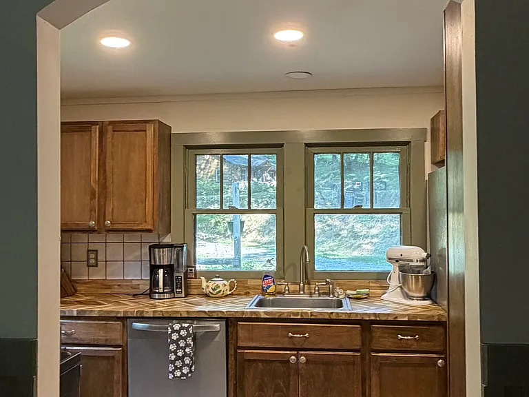 Kitchen includes dishwasher, oven, refrigerator, and microwave