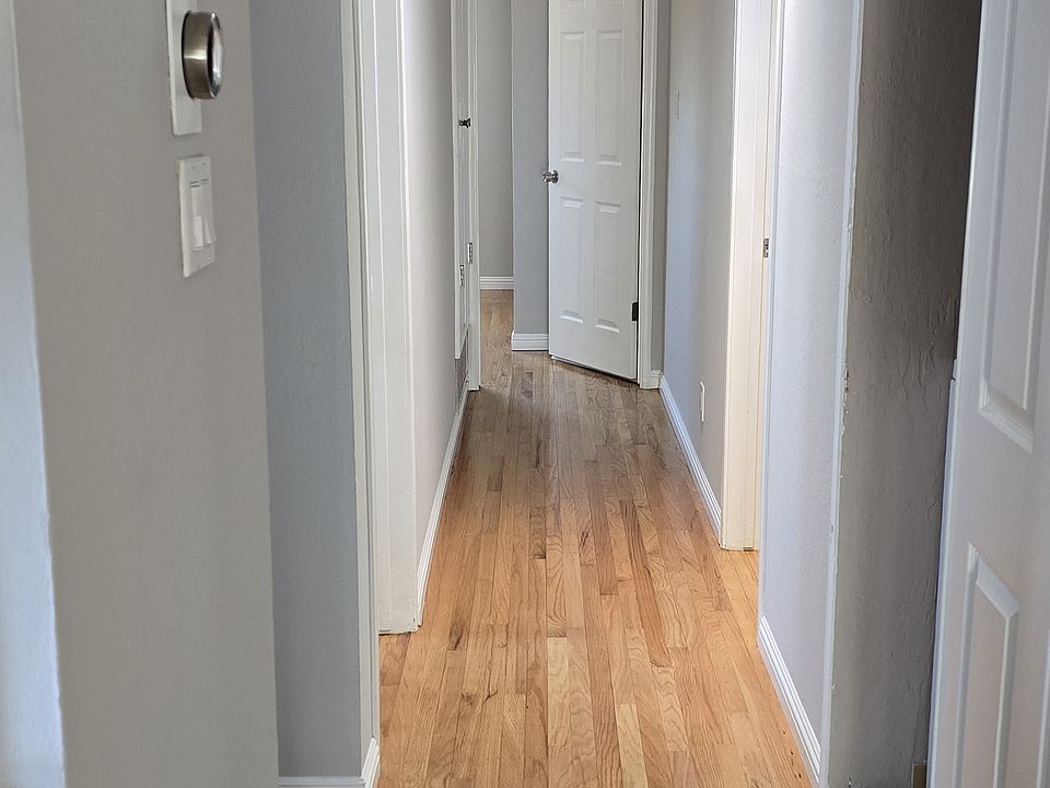 Hallway. Laundry on right with sliding door