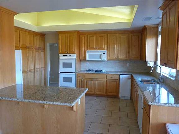 Open Granite Kitchen With Plenty of Storage