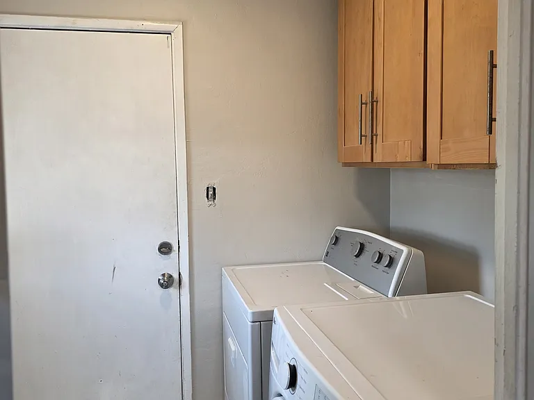 Laundryroom inside apartment, full size washer and dryer