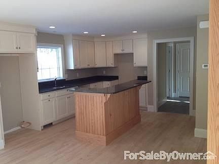 Gleaming hardwood floors-just pick out your appliances!