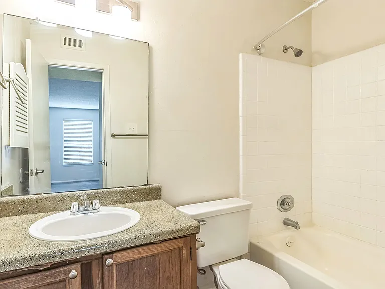 Modern bathrooms feature a full tub and shower combination with quality fixtures, professionally operated by Highlands Vista Group.