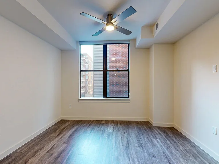 Apartment Living Room with Wood Style Flooring.