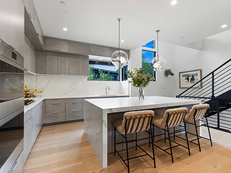 Kitchen Island with stairs to 2 King suites upstairs with ensuite baths