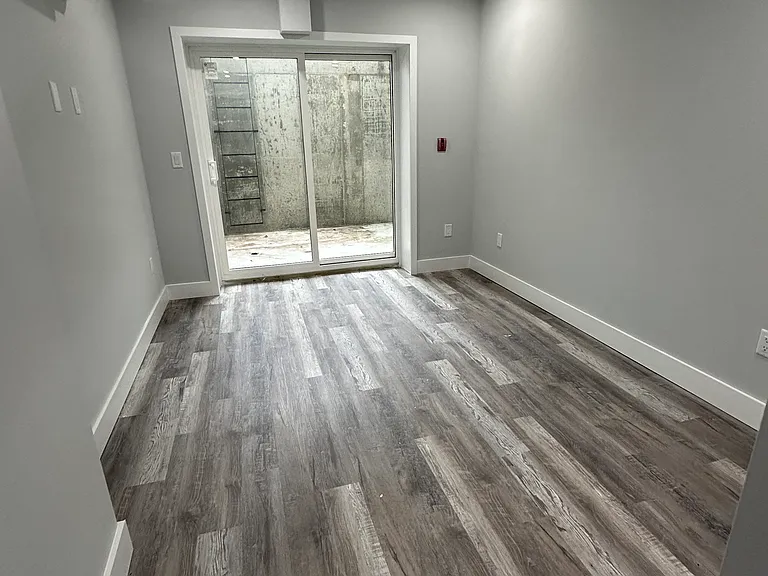 Master Bedroom in basement with a Sunken Patio