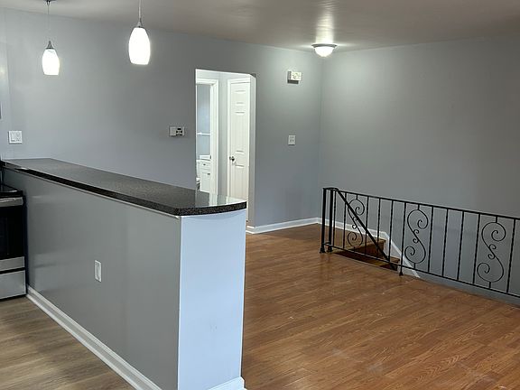 Kitchen bar and part of living room