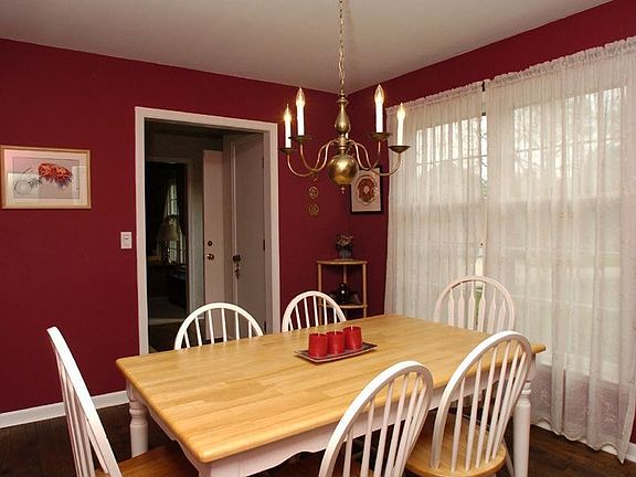 Dining Rm- Rich colors, floor length windows, window trmts, hardwoods