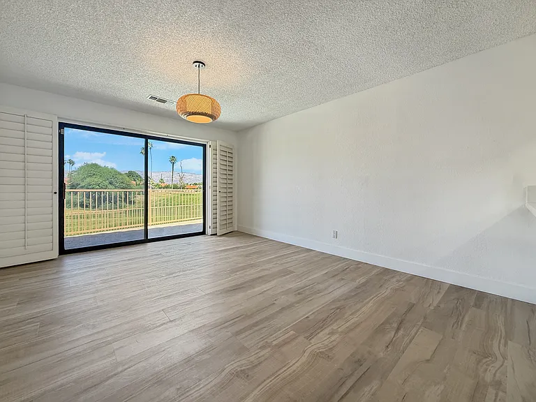 Dining area with pool and golf course view