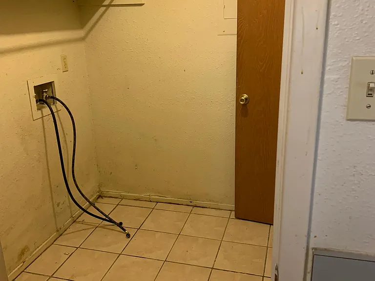 Waher Dryer Seperate utilitey room with ceramic tile and extra storage that exits under staircase.