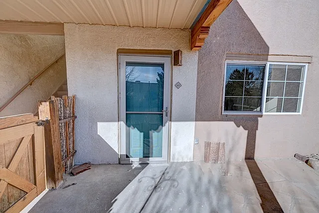 A private patio provides a sun-drenched entry way - 2210 Miguel Chavez Rd #813