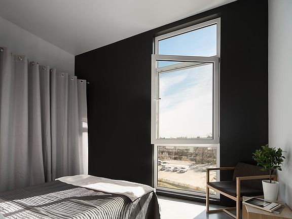 Upstairs bedroom with operable window and comes with a roller shade.