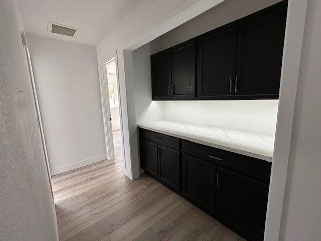 Hallway with modern cabinet and lighting.