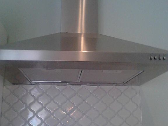 Extraction fan/stove exhaust