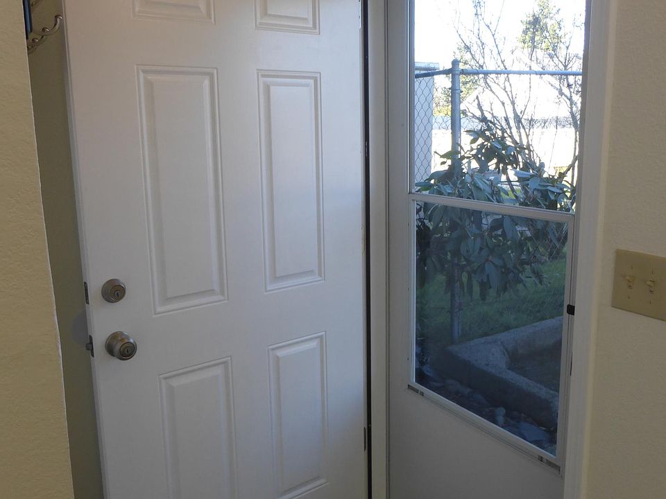 Front entry door from inside home and coat rack for your quick exits.