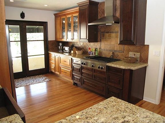 Granite, newer cabinets, stainless appliances