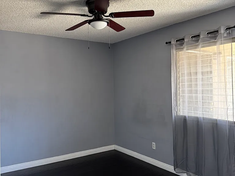 1st bedroom. with ceiling fan