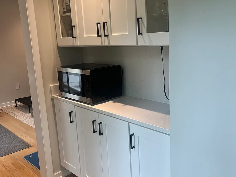 Butlers pantry/bar/coffee station hidden from view but perfect for entertaining. Situated between the bonus room and the kitchen. The open concept layout enables circular flow and access to decks from two rooms