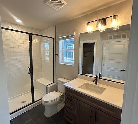 Large bath with walk in shower and walk-in closet access