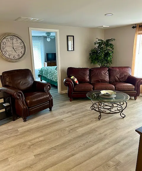 Living room space leather sofa and chair.