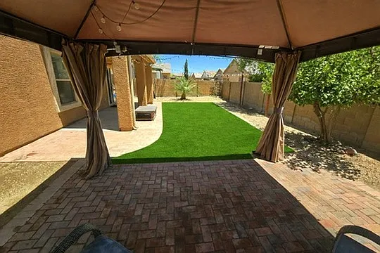 Backyard upgraded with new turf, rocks and shade sail (not pictured here) for additional shade.