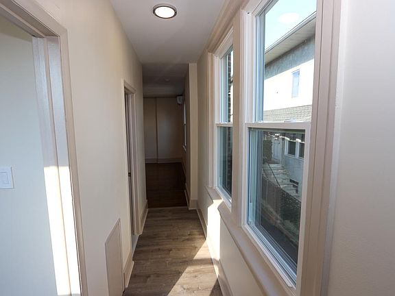 Entry Hallway. Kitchen located directly to your first left. Full bathroom located to your second left. Living room located directly straight ahead.