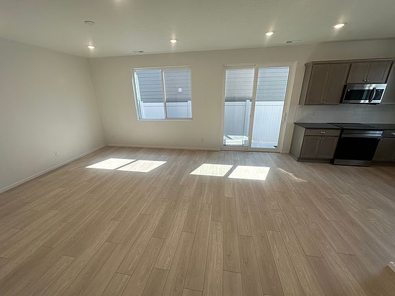 Great room with walk out slider to fully fenced side yard