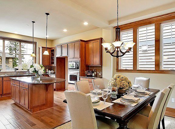 Kitchen with custom alder "shaker style" cabinets, granite slab counter tops with full height cerami