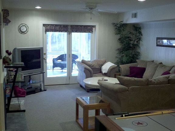 Lower level living area featuring game room, two BR, BA and laundry room