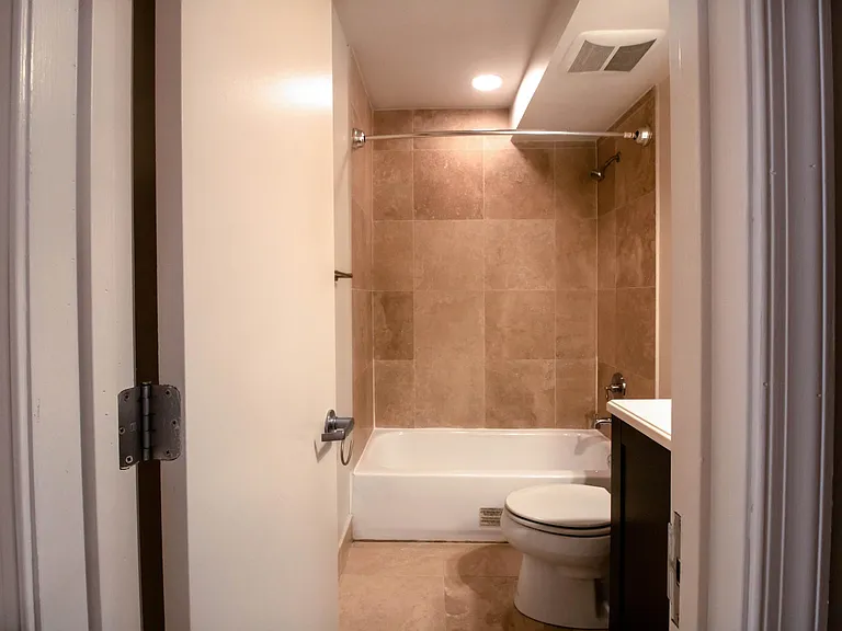 Hall bathroom with tub/shower conbination.