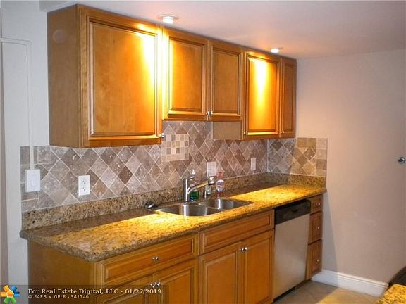 TILE BACKSPLASH, PLENTY OF CABINETS, STAINLESS STEEL DISHWASHER