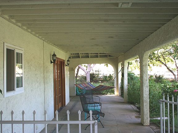 Cozy 180 deg wraparound porch