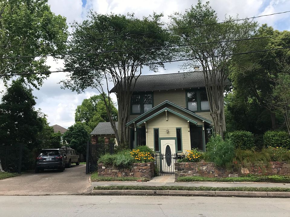 Street view of property, apartment is to the left of the house