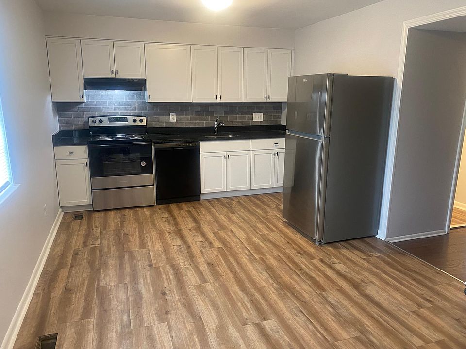 New kitchen cabinets and appliances with granite countertops