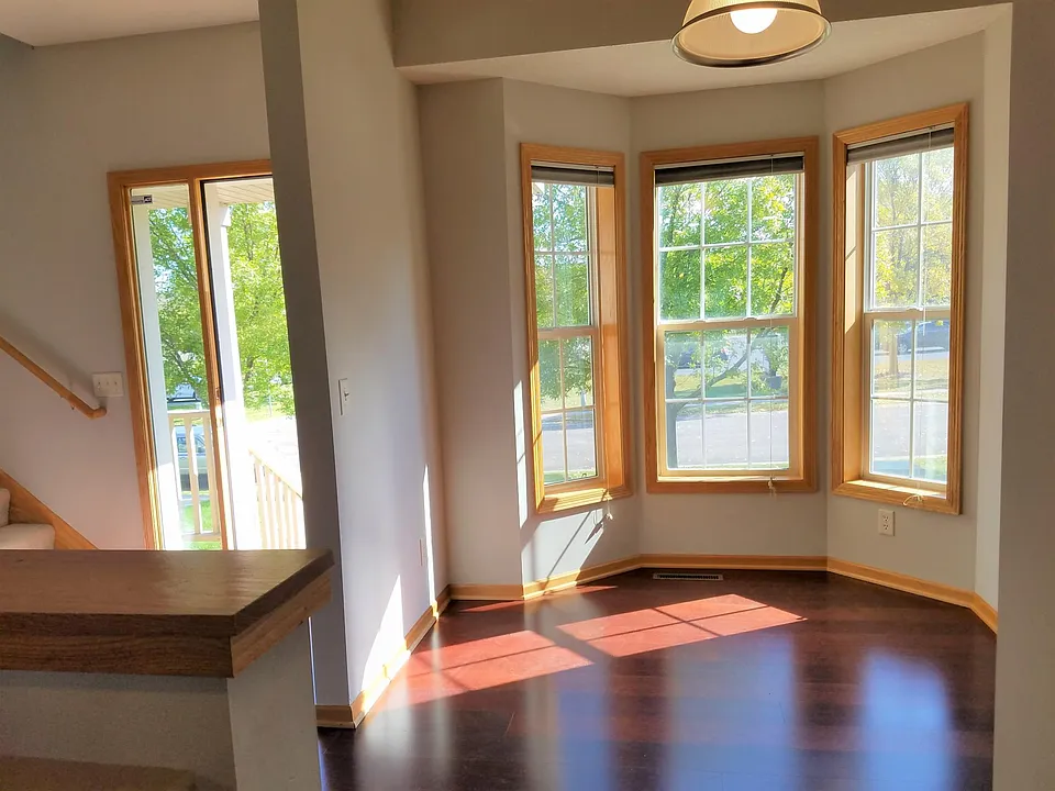 Bay windows, front door and stairs to bedrooms