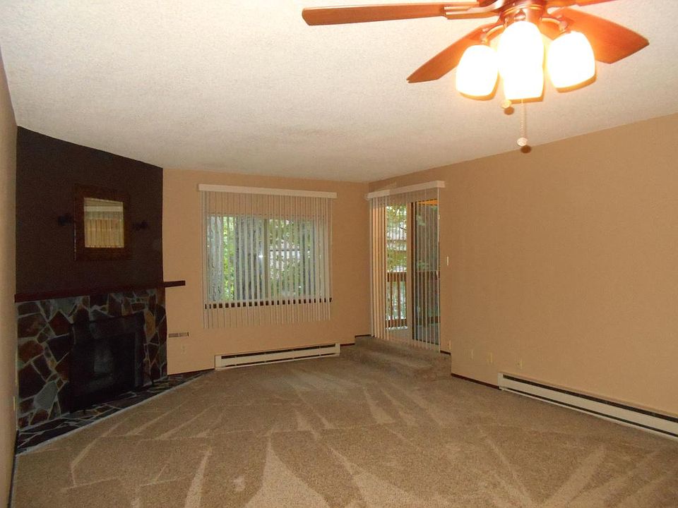 Dramatic wood-burning fireplace and view