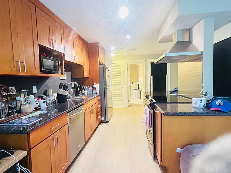 Spacious, granite counter top kitchen with lots of natural sunlight.