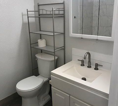 Renovated bathroom with tub and shower