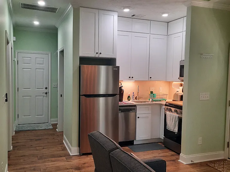Full kitchen, extra cabinet space, hall way and pantry.