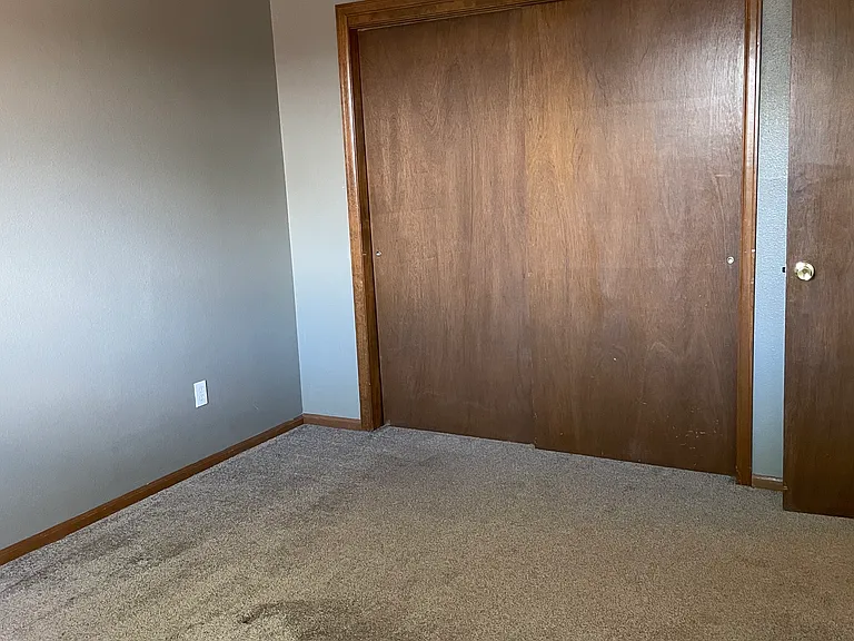 Unit 5- looking from one corner to the other of first bedroom