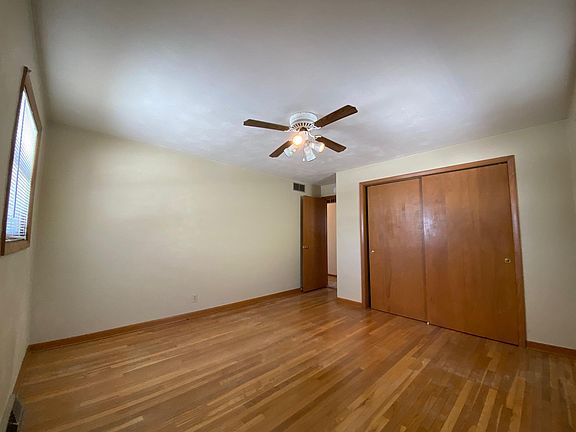 Large bedroom, hardwood floors with large closet